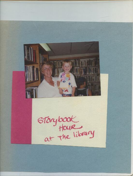 photo of Bonnifer Schweizer, former volunteer and board member, with a young patron at storybook hour at the library.